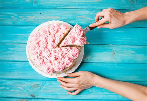 How to cut a round cake - 2. Make another cut next to the first one, also straight down the middle, to create a rectangle. 3. Remove the rectangle you just created. 4. Push the remaining two halves of the cake back ...
